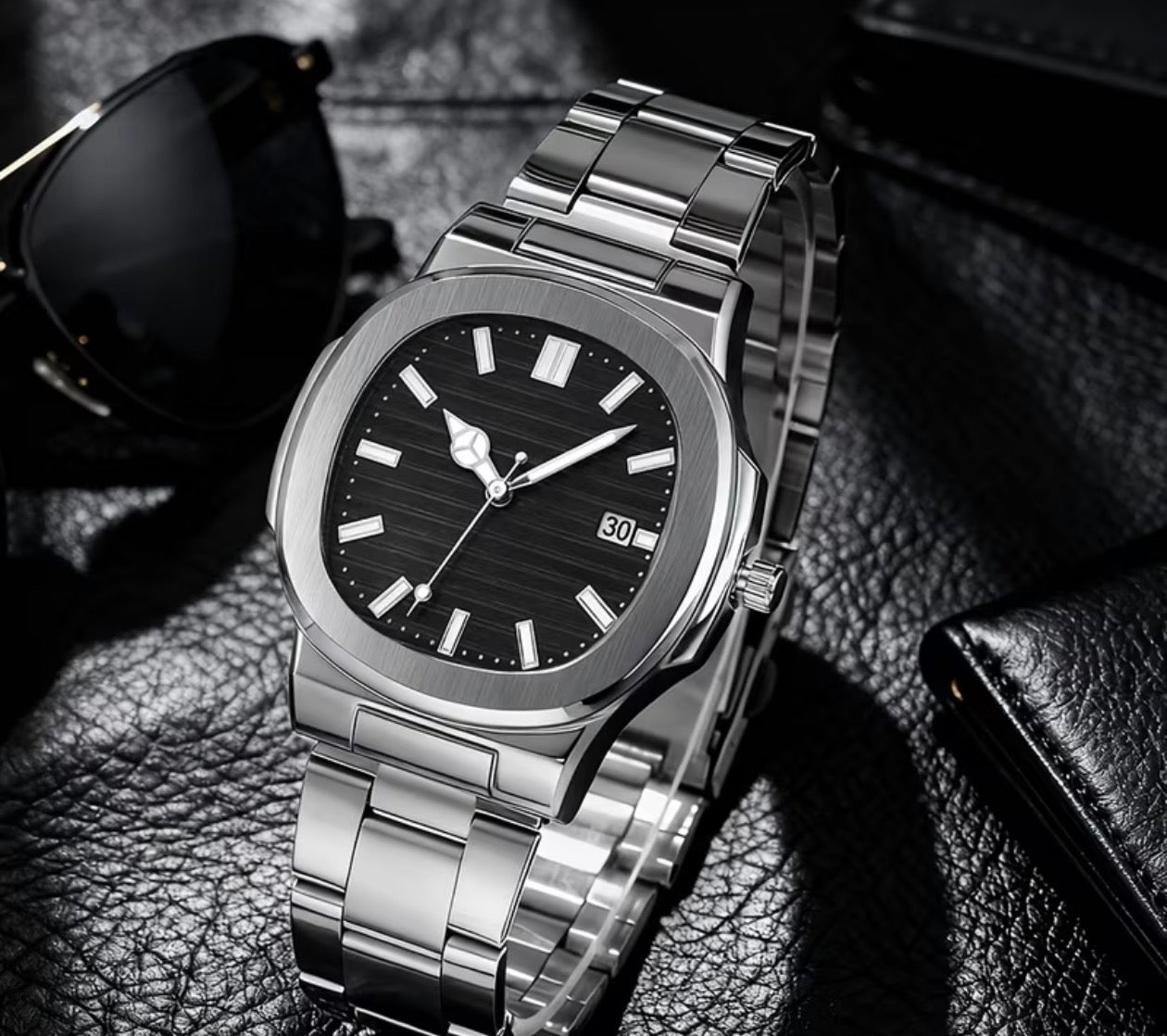 "Midnight Nautilus – Sleek Black Integrated Luxury Watch"